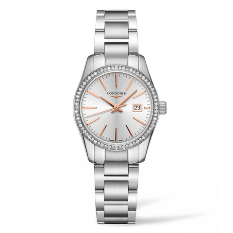 Longines Conquest Classic-29.5mm stainless steel case with diamond bezel, silver dial. Date display. Quartz movement. Water resistance of 5 bar. Stainless steel bracelet