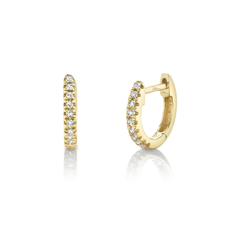Shy Creation Diamond Mini Huggie Earrings in 14 karat yellow gold with diamonds totaling 0.04 carats.