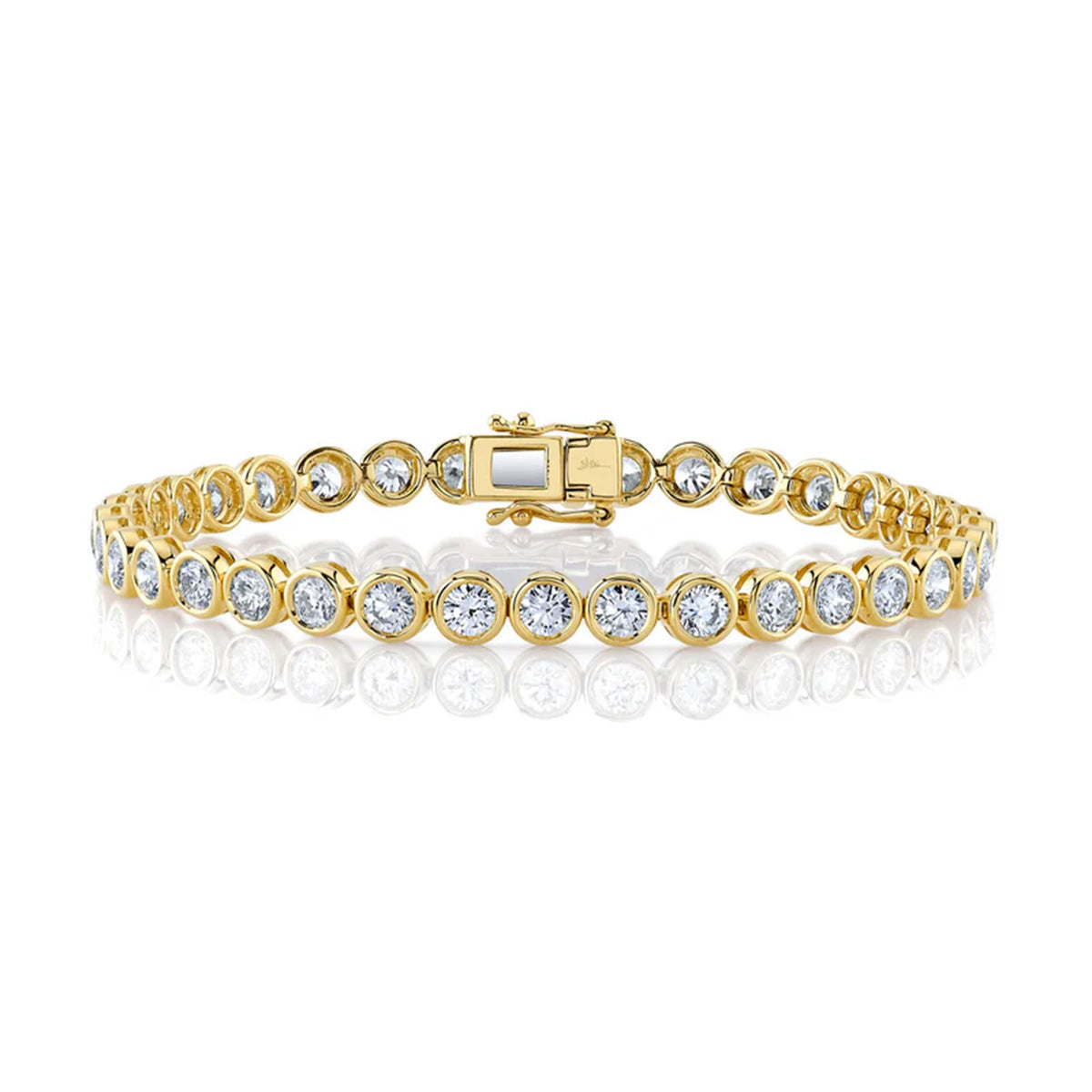 Shy Creation Diamond Bezel Tennis Bracelet in 14 karat yellow gold with diamonds totaling 7.00 carats.

