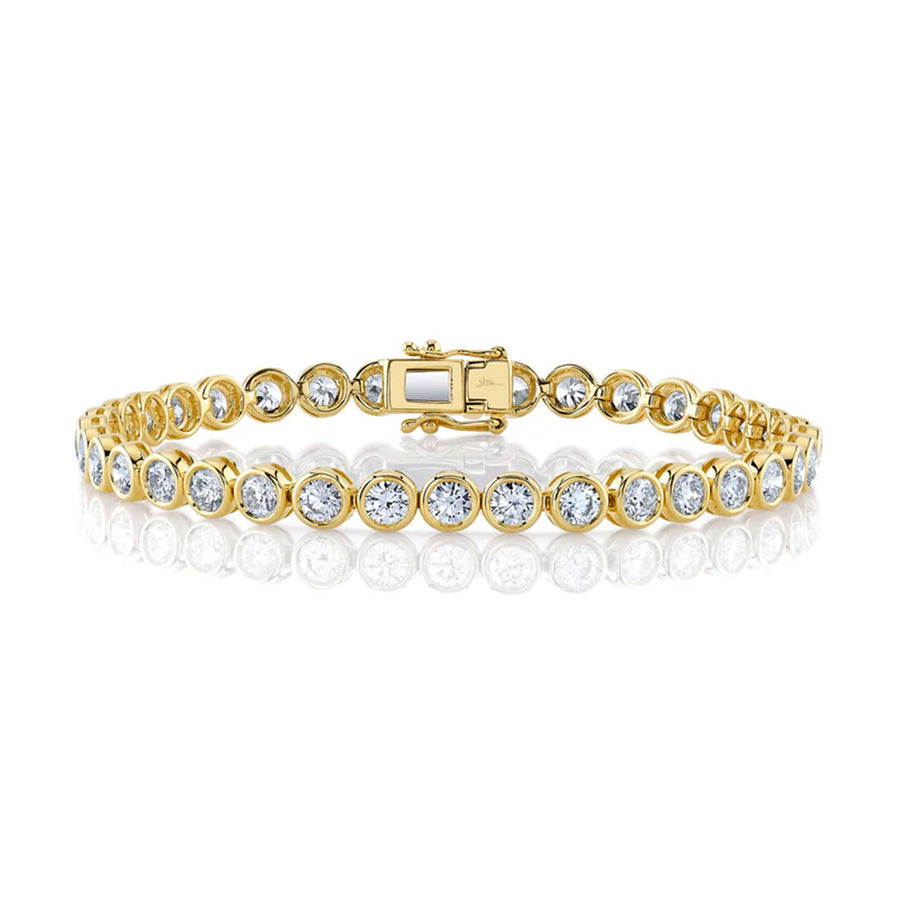 Shy Creation Diamond Bezel Tennis Bracelet in 14 karat yellow gold with diamonds totaling 7.00 carats.
