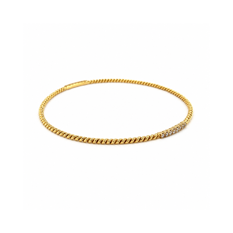 18 karat yellow gold diamond bangle.