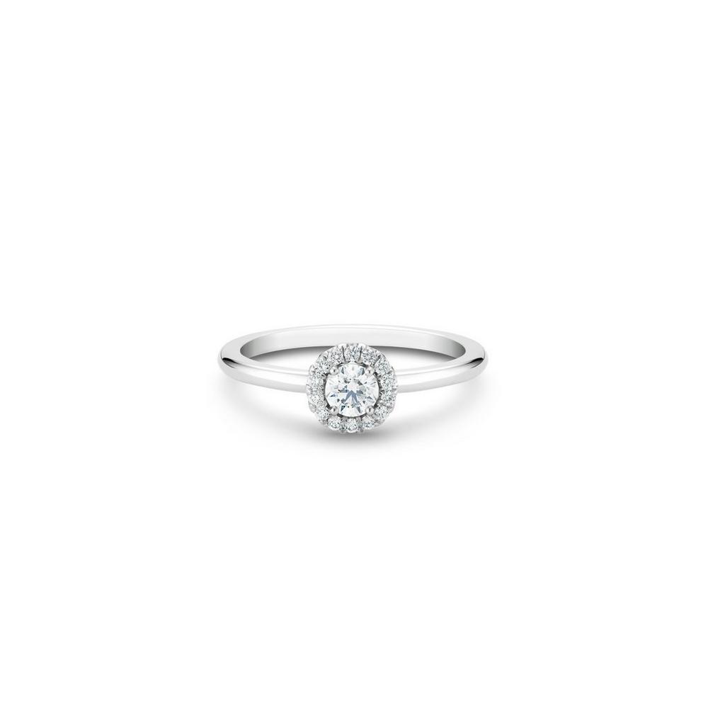 De Beers Aura Round Brilliant Diamond Ring in platinum. The ~0.20 carat round brilliant solitaire is surrounded by a halo of micropavé diamonds totalling ~0.10 carats.