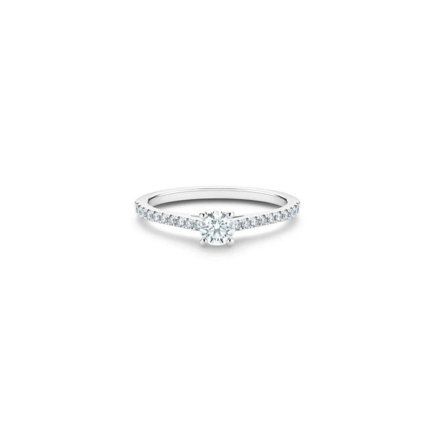 De Beers Classic Pavé Round Brilliant Diamond Ring in platinum with a center stone approximately 0.20 carats and micropavé diamonds on the setting with a total weight of 0.37 carats.
