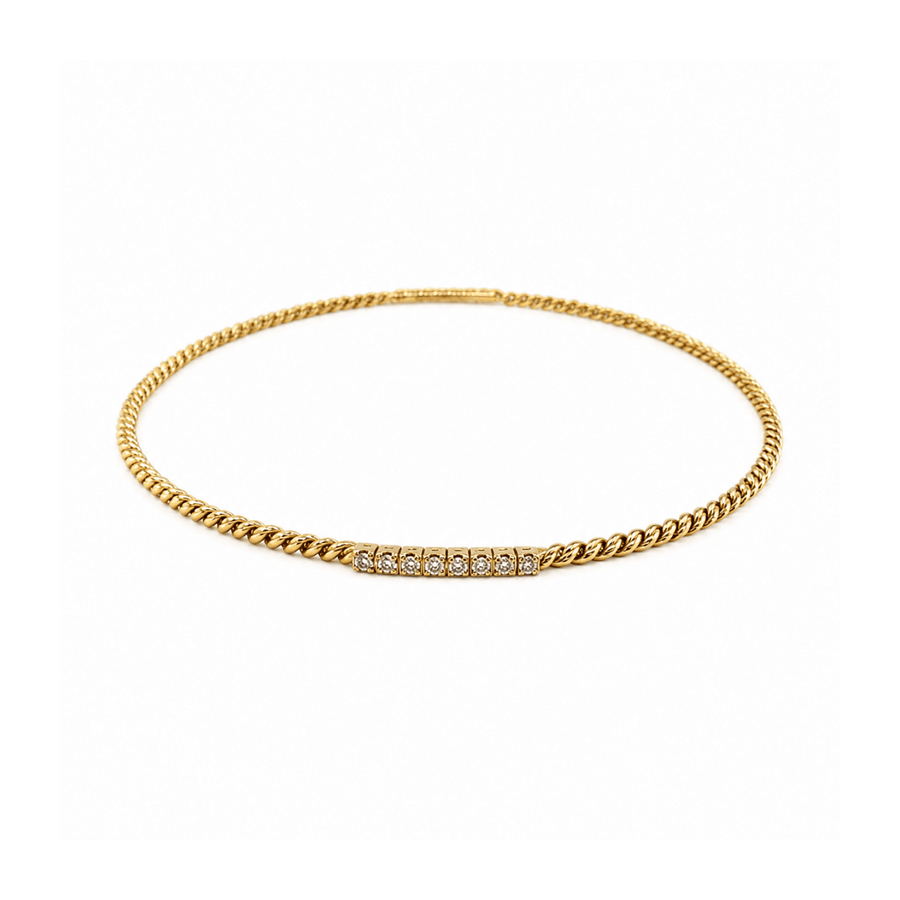 18 karat yellow gold diamond bangle.