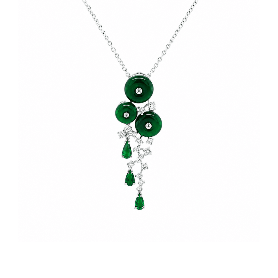 Silver-tone necklace featuring three round emerald-green elements framed by clear crystal detailing, with three faceted green teardrop stones suspended below. Finished with a fine link chain.
