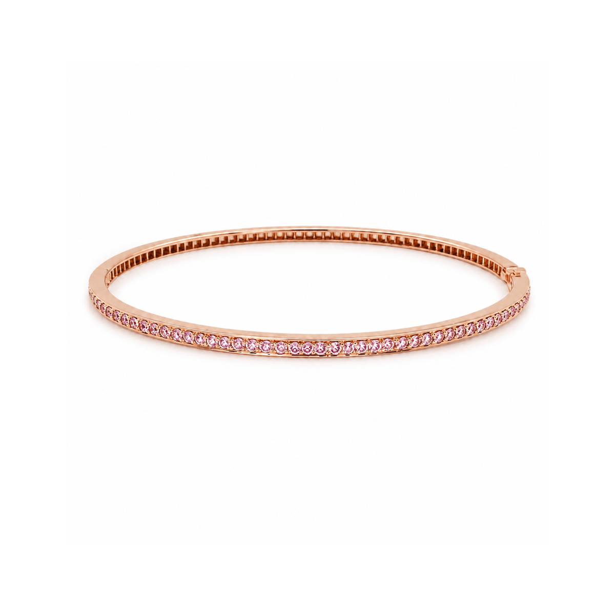 18K rose gold bangle bracelet featuring a single row of channel-set round pink sapphires