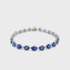 18 karat white gold sapphire diamond bracelet. Sapphire totaling 18.26 carats. Diamond, totaling 0.4 carat weight. The length of the bracelet measures 7 inches.