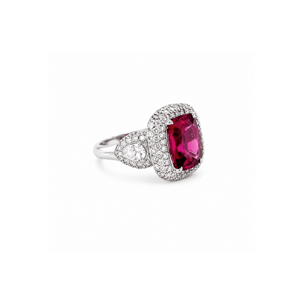 18K white gold ring featuring a center cushion-cut rubellite, surrounded by a double diamond halo, flanked by half-moon diamonds on each side.