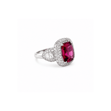 Rubellite Diamond Ring-18K white gold ring featuring a center cushion-cut rubellite, surrounded by a double diamond halo, flanked by half-moon diamonds on each side.