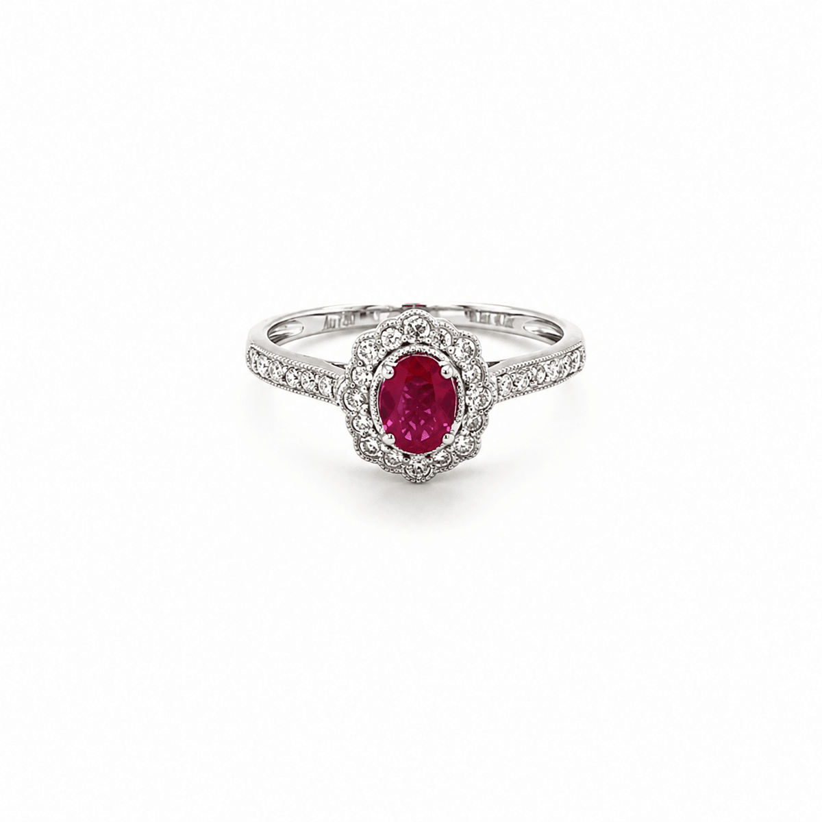 18K white gold ring featuring a center oval-cut ruby
