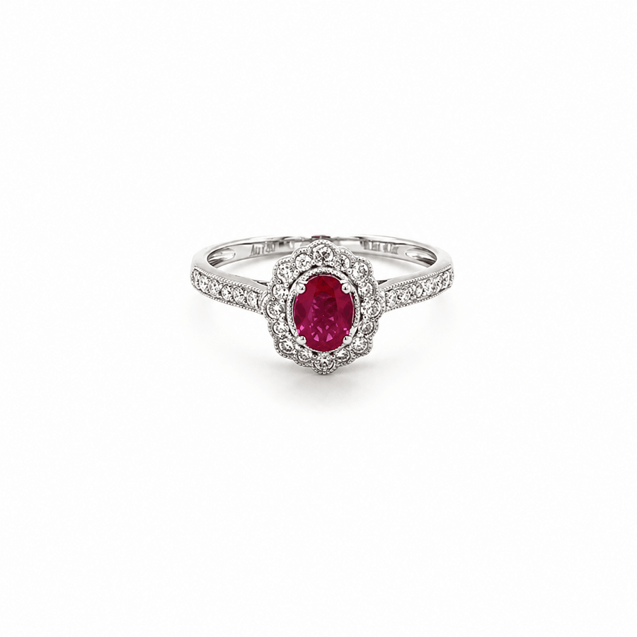 18K white gold ring featuring a center oval-cut ruby