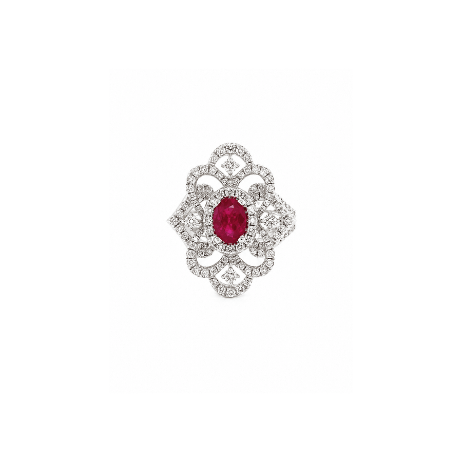 18K white gold ring featuring a center oval-cut ruby
