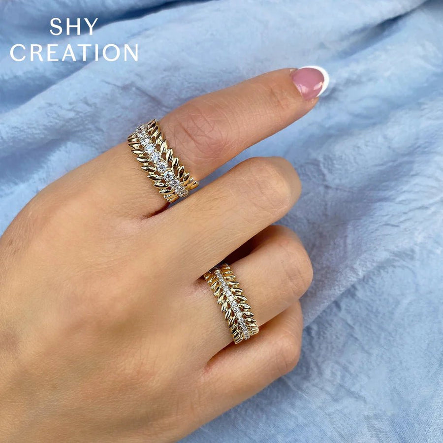 Shy Creation Kate Diamond Laurel Wreath Band - SC55022938 Shy Creation Diamond Laurel Wreath Band in 14 karat yellow gold with diamonds totaling 0.19 carats.