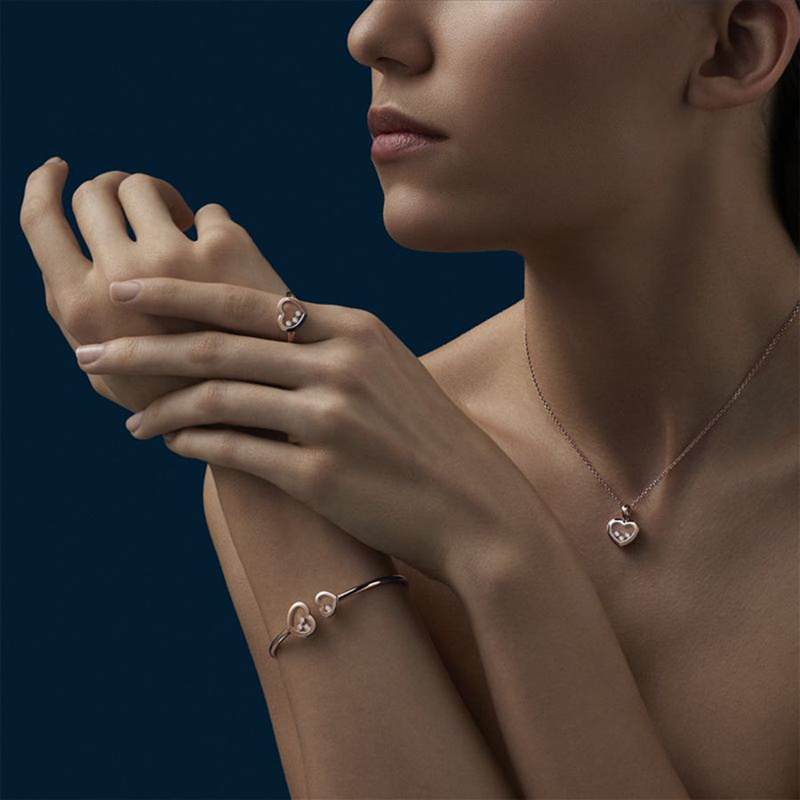 Model wearing Chopard Happy Diamonds Icons in 18 karat rose gold with diamonds.