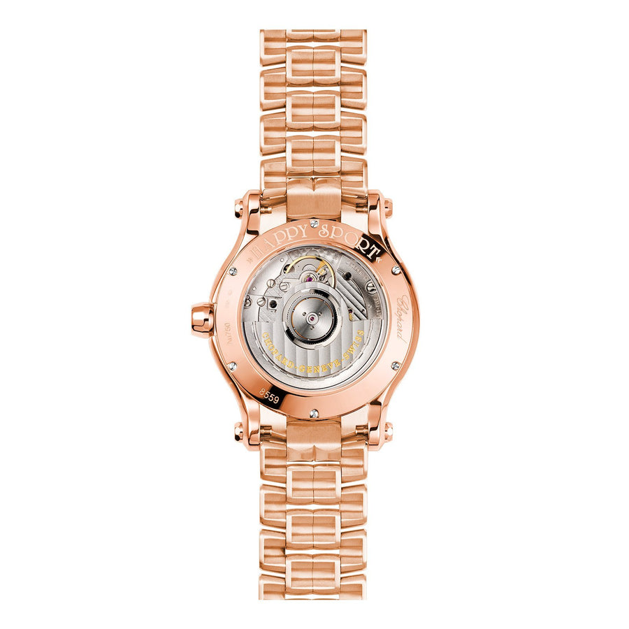 Chopard Happy Sport in 36mm rose gold case with silver dial and seven floating diamonds on rose gold bracelet, featuring a date display and automatic movement with 62 hours power reserve.
