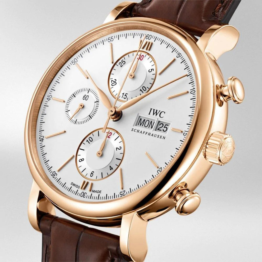 IWC Schaffhausen Portofino Chronograph 42 in rose gold with silver dial on leather strap featuring a chronograph function, day date display and automatic movement.