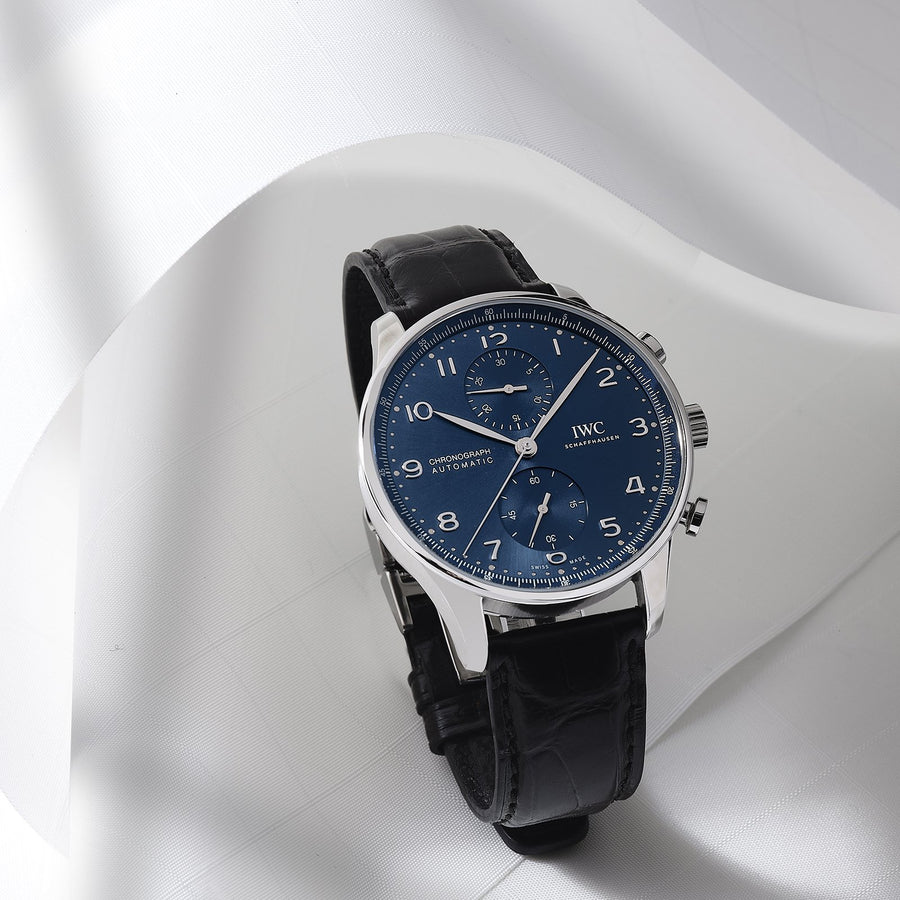 IWC Schaffhausen Portugieser Chronograph 41 in stainless steel with blue dial on leather strap, featuring a chronograph function and automatic movement.
