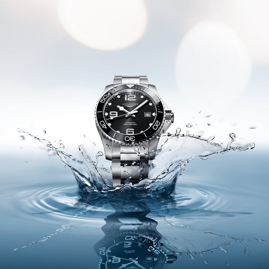 Longines HydroConquest in a 41mm stainless steel case with black dial on stainless steel bracelet, featuring date display and automatic movement with up to 72 hours of power reserve.