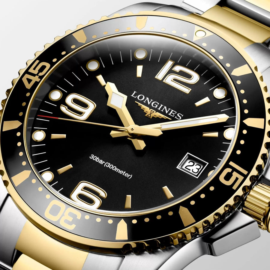 Longines HydroConquest in a 41mm stainless steel/yellow gold pvd case with black dial on stainless steel/yellow gold pvd bracelet, featuring a date display and quartz movement.