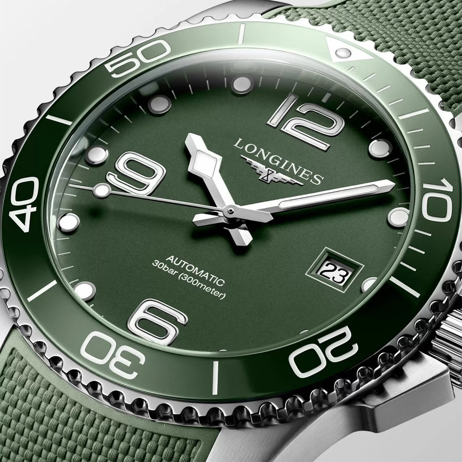 Longines HydroConquest in a 41mm stainless steel case with green dial on green rubber strap, featuring a date display and automatic movement with up to 72 hours of power reserve.