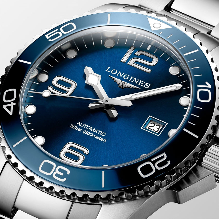 Longines HydroConquest in a 43mm stainless steel case with blue dial on stainless steel bracelet, featuring a date display and automatic movement with up to 72 hours of power reserve.