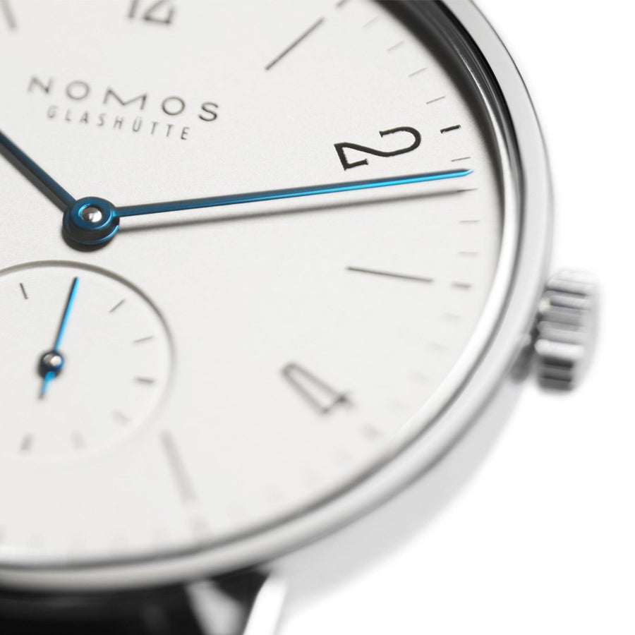 NOMOS Glashütte Tangente - NOMOS Glashütte Tangente in a 35mm stainless steel case with white dial on leather strap, featuring a small seconds display and a hand-wound mechanical movement with up to 43 hours of power reserve.