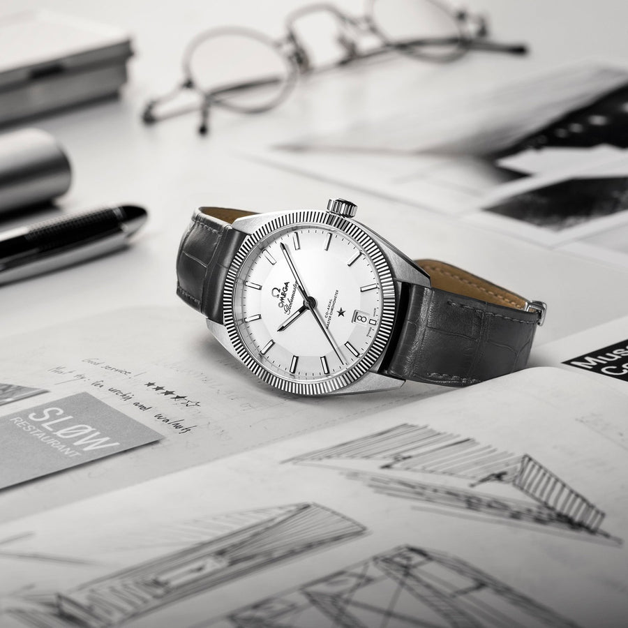 Omega Globemaster Omega Co-Axial Master Chronometer in a 39mm stainless steel case with silver dial on leather strap, featuring a date display and automatic movement.