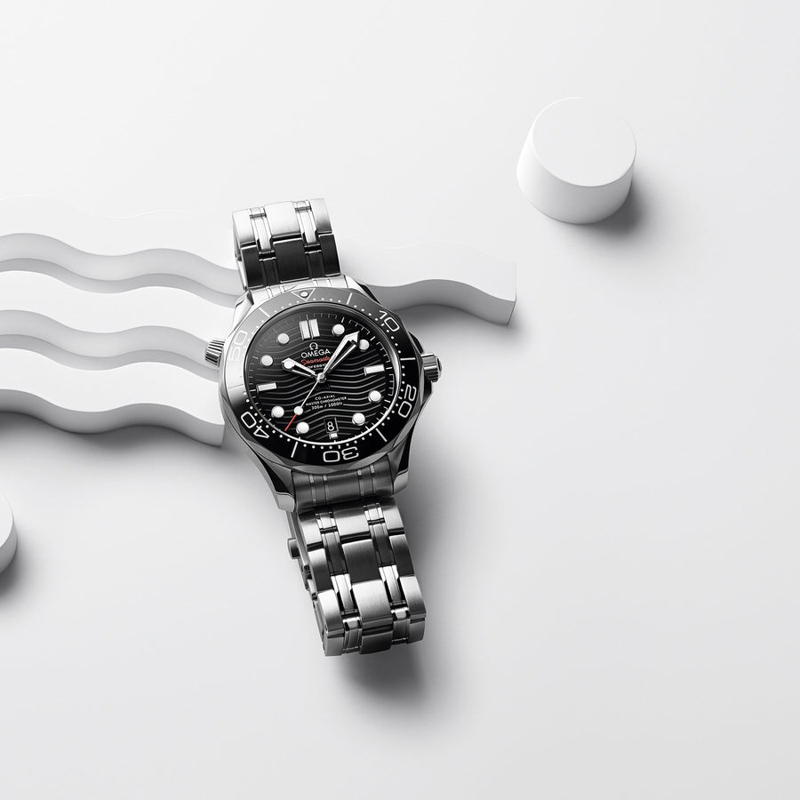 Omega Seamaster Diver 300M Co-Axial Master Chronometer in a 42mm stainless steel case with black dial on stainless steel bracelet, featuring a date display and automatic movement.