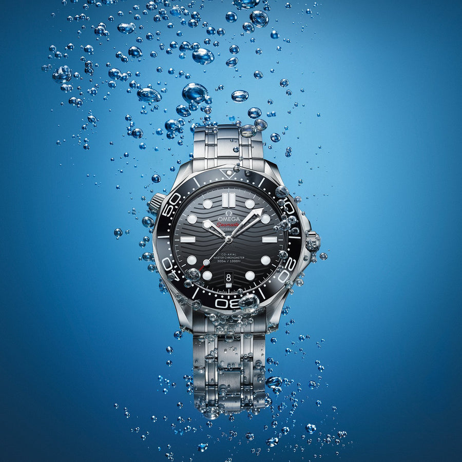 Omega Seamaster Diver 300M Co-Axial Master Chronometer in a 42mm stainless steel case with black dial on stainless steel bracelet, featuring a date display and automatic movement.