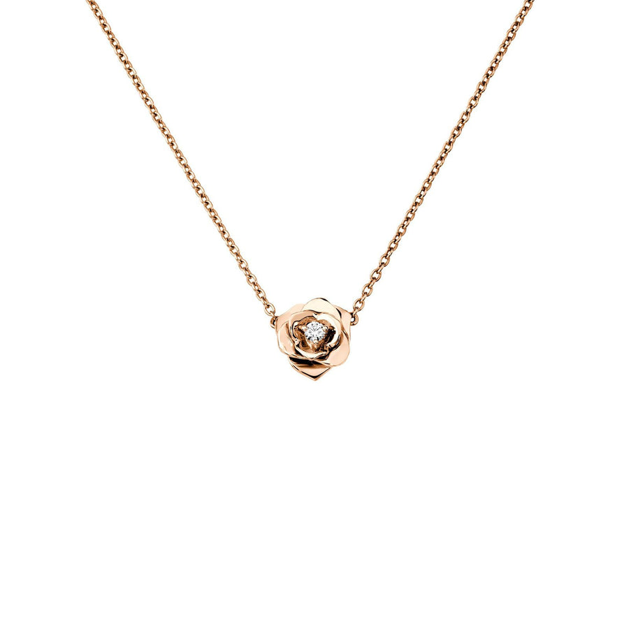 Piaget Rose Pendant in 18 karat rose gold with a center diamond totaling 0.06 carats.