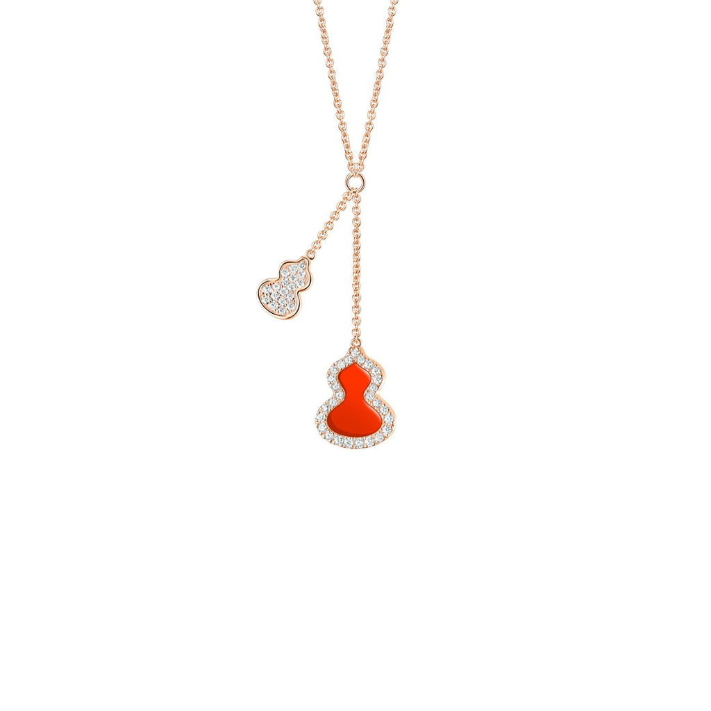 18 karat rose gold with one red agate and diamond wulu pendant and one pave diamond wulu pendant necklace.