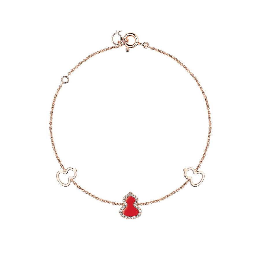 Qeelin Wulu Bracelet - 18 karat rose gold with one red agate and diamond wulu in the center and two gold wulu on each side.