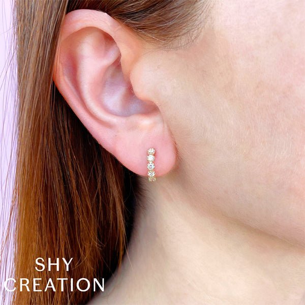Shy Creation Diamond Crown Setting Huggie Earrings - SC55023899 Shy Creation Diamond Crown Setting Huggie Earrings in 14 karat yellow gold with diamonds totaling 0.54 carats.