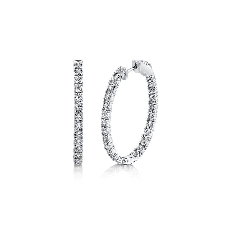 Shy Creation Diamond Oval Hoop Earrings in 14 karat white gold with diamonds totaling 1.10 carats.