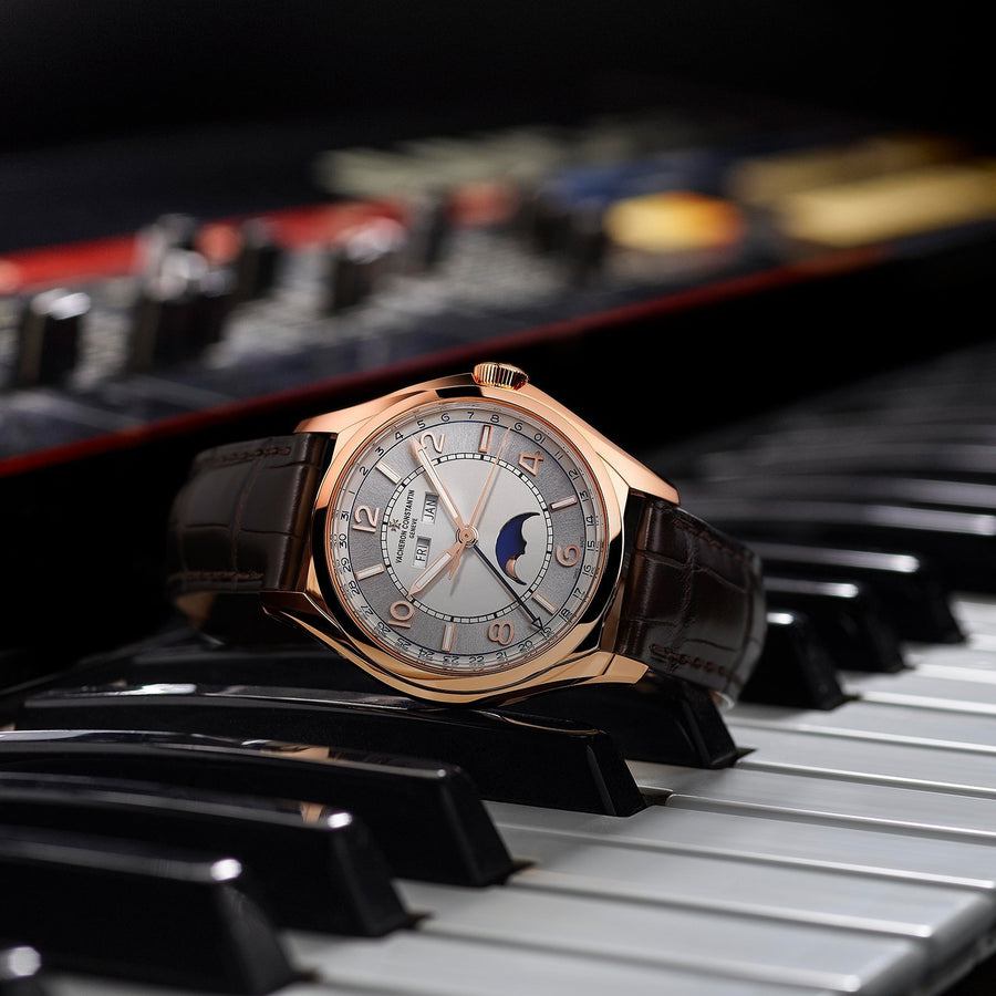 Vacheron Constantin Fiftysix Complete Calendar in a 40mm rose gold case with silver dial on leather strap, featuring a complete calendar, moon phase and automatic movement.